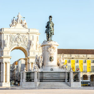 Morning view on the Commerce square with statue fo king Joseph and Triumphal arch in Lisbon city, Portugal